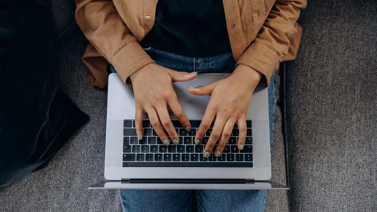 Person typing on a keyboard