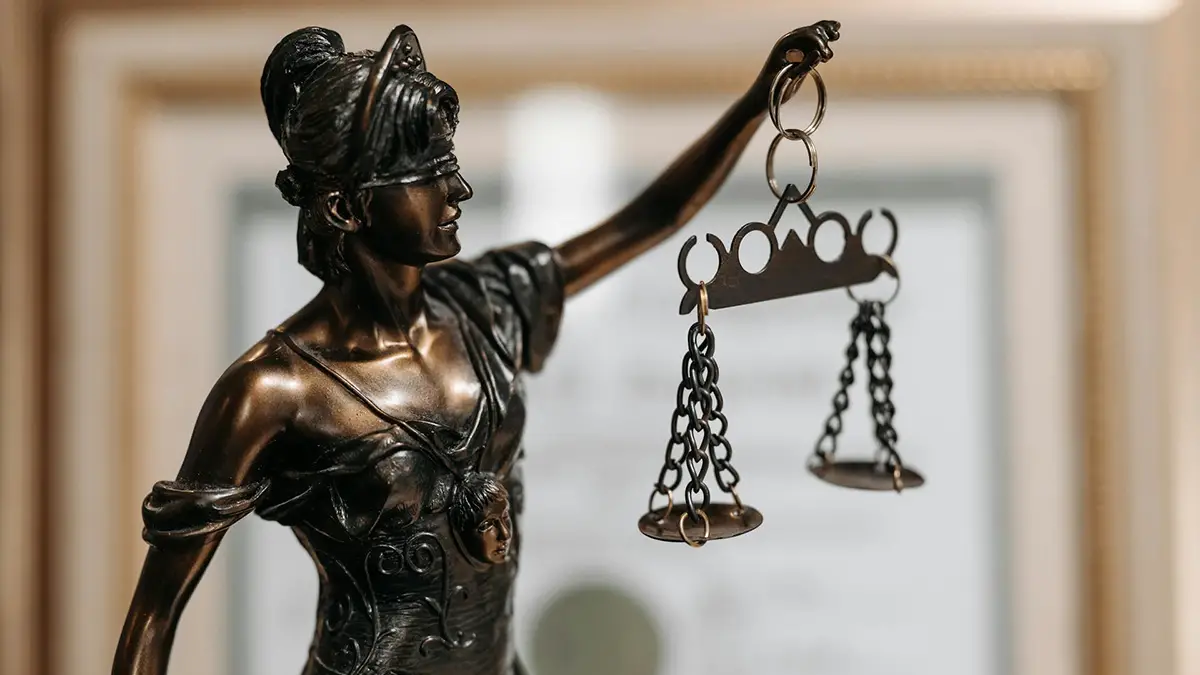 A statue hold scales (of justice)